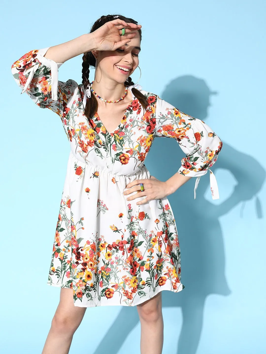 Berrylush Women White & Orange Floral Printed V-Neck Tie-Up Crepe Three-Quarter Sleeves Pleated Fit & Flare Mini Dress